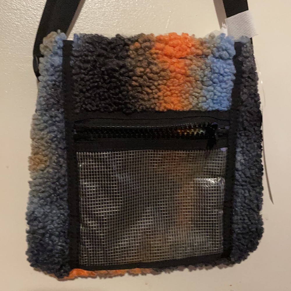 Qty 1 brand new tie dye sherpa adjustable crossbody bags.